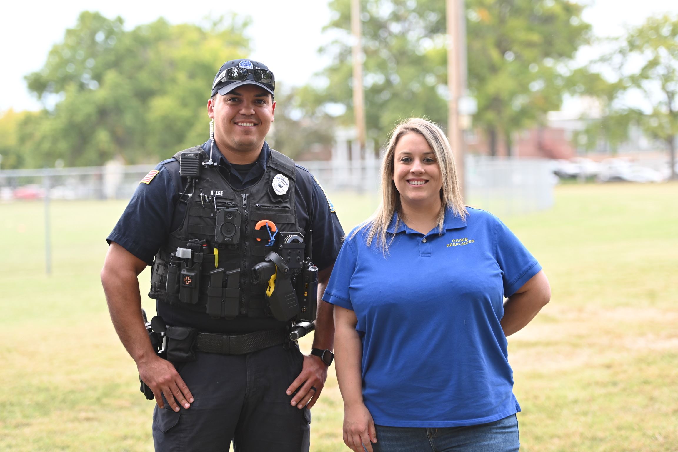 rcpd officer and a mental health co responders smiling at the camera