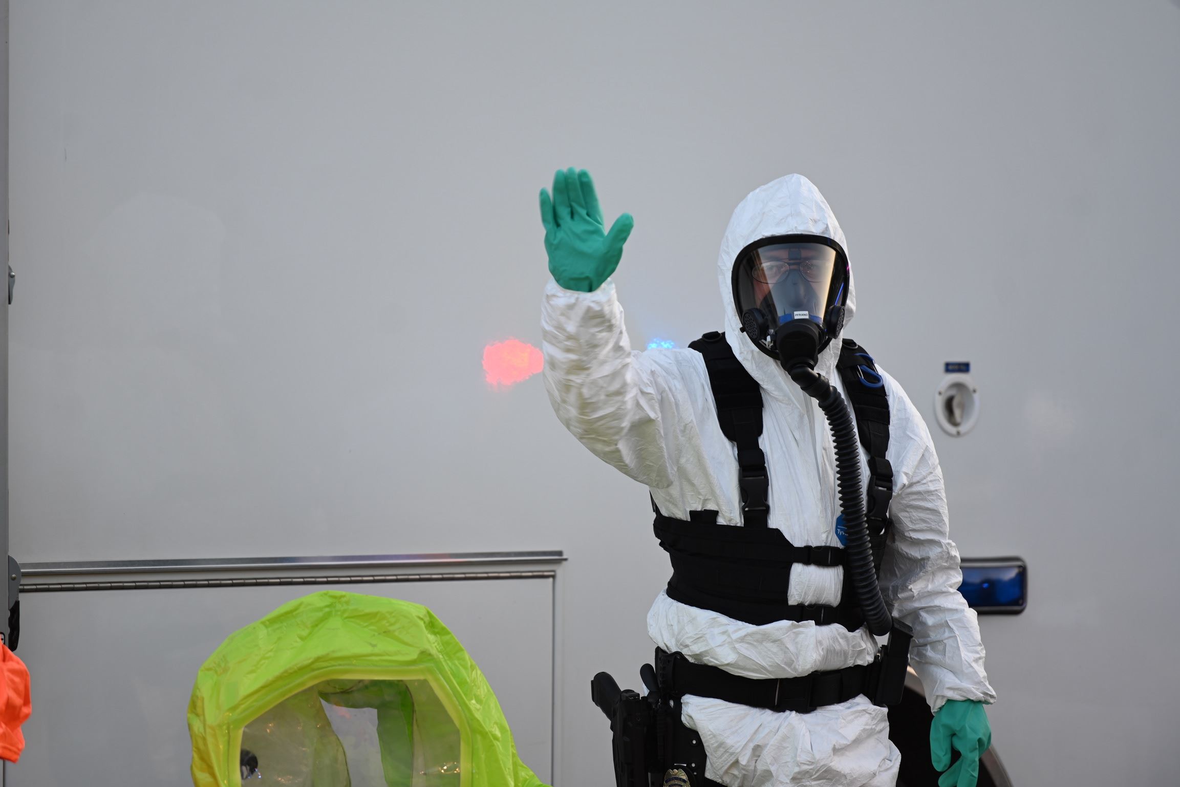 Member of the Hazardous Evidence Response Team in a Hazmat Suit