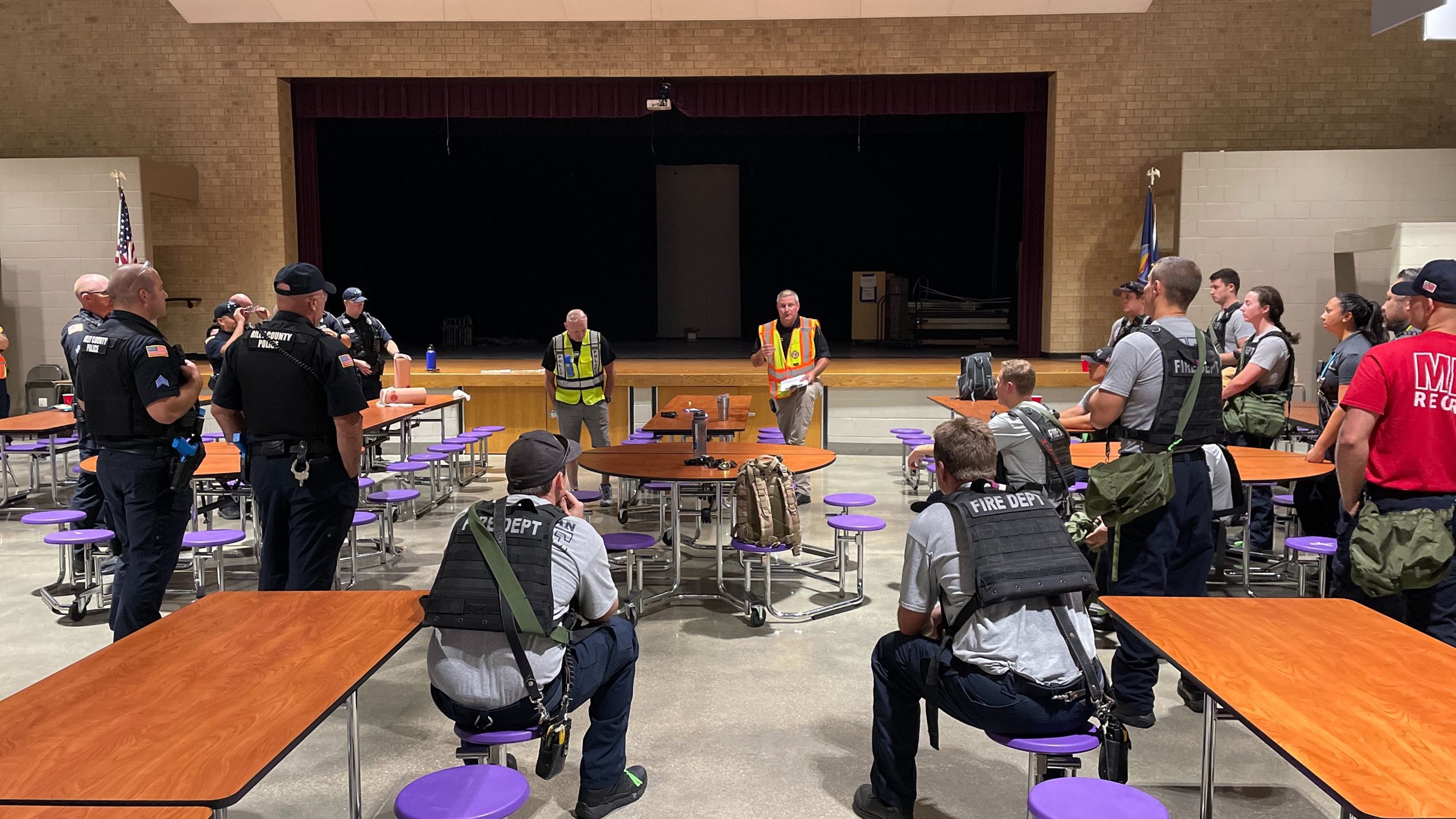 Active Violence Training Group of First Responders Stand listening to briefing